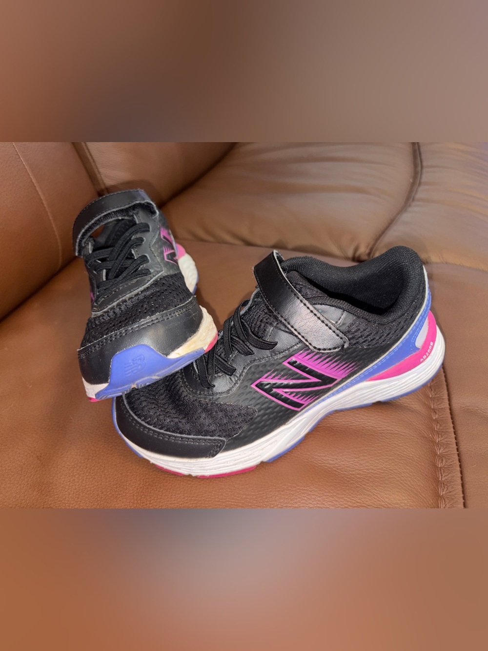 New Balance Kids Black Sneakers with Pink and Blue Accents